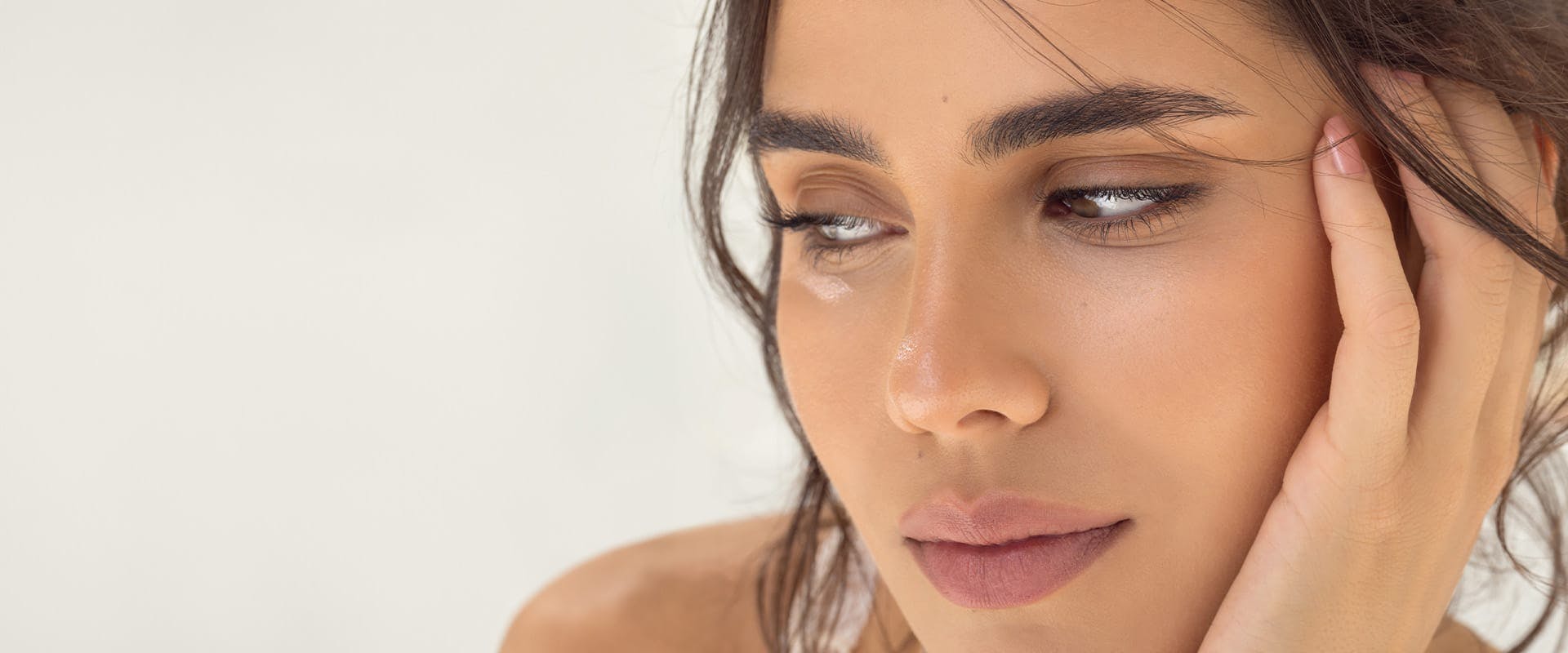 woman resting her face in her hand