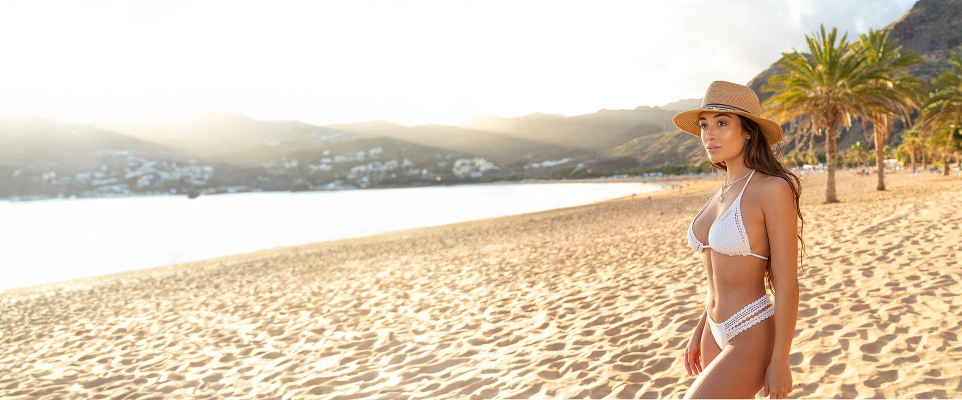 woman in a bikini standing on a beach