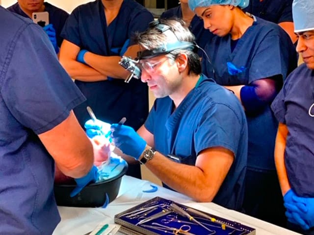 Dr. Rahban demonstrating a surgical procedure