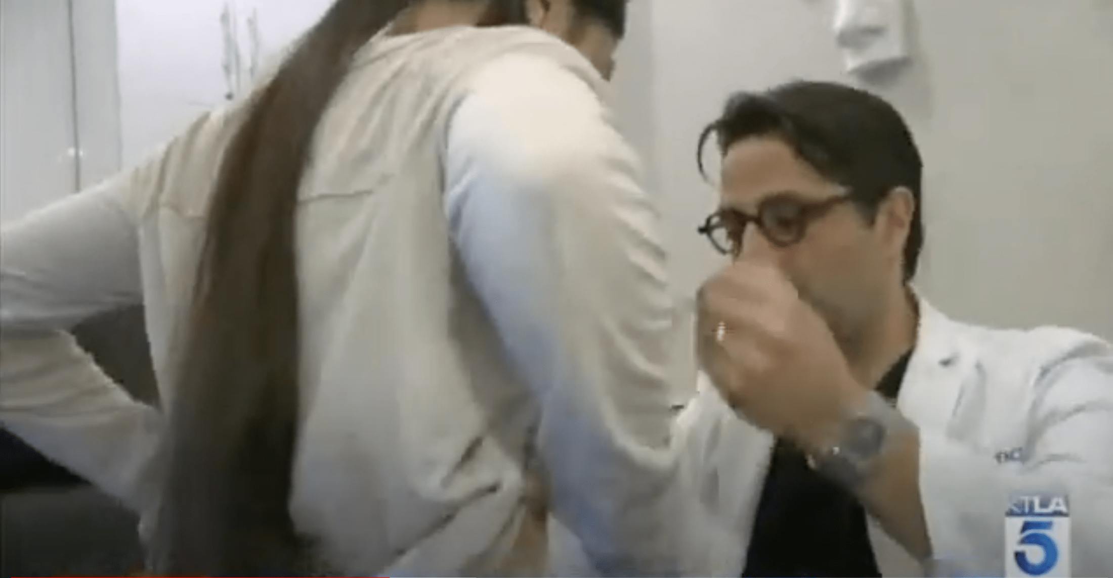 Dr. Rahban examining a patient