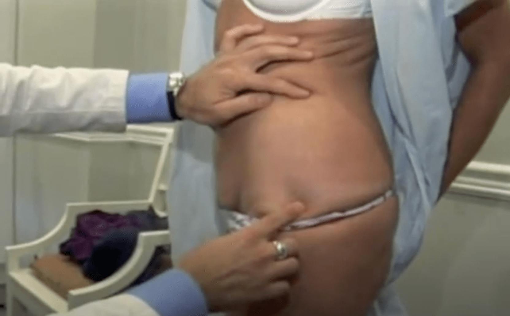 Dr. Rahban examining a patient's side