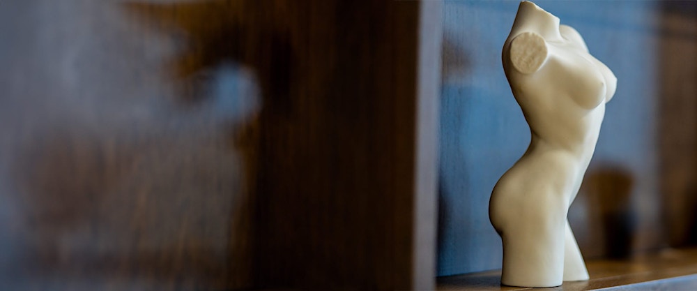 small sculpture of female body