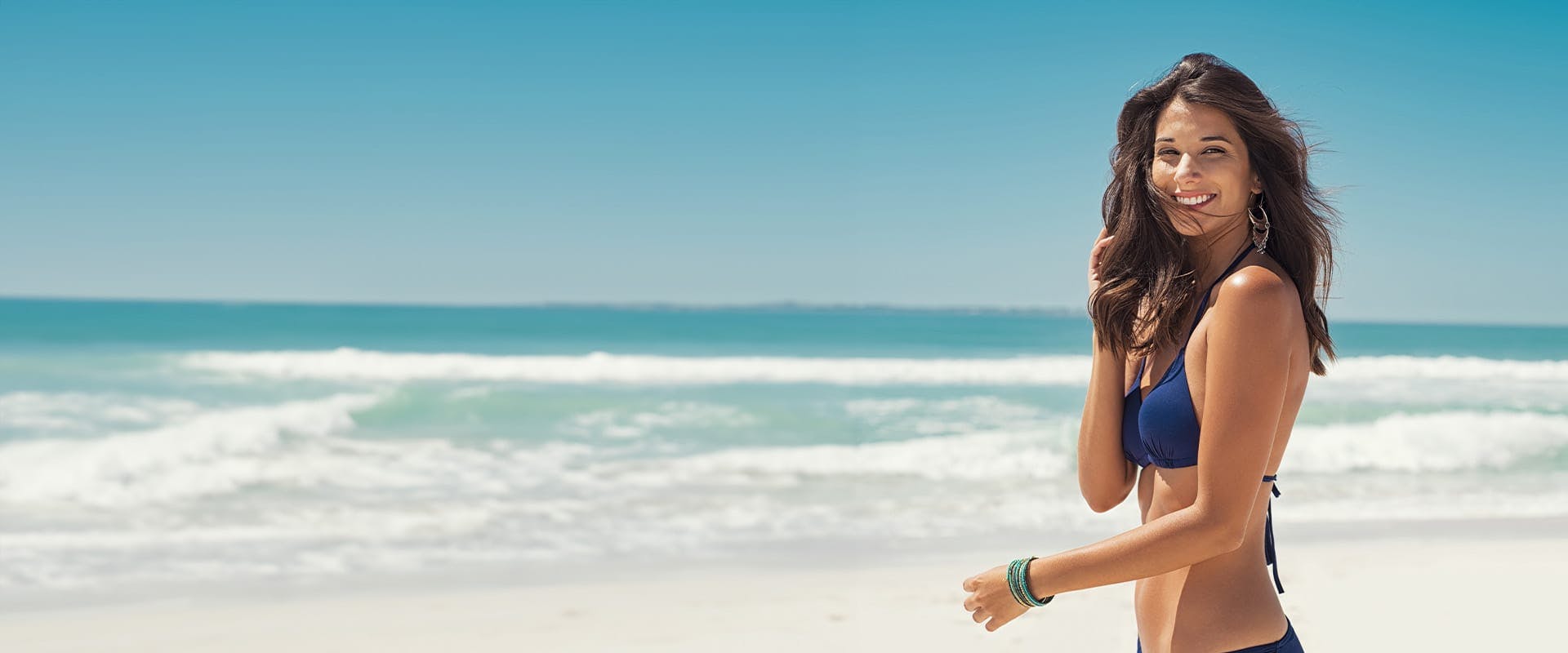 woman in a blue bikini at the beach