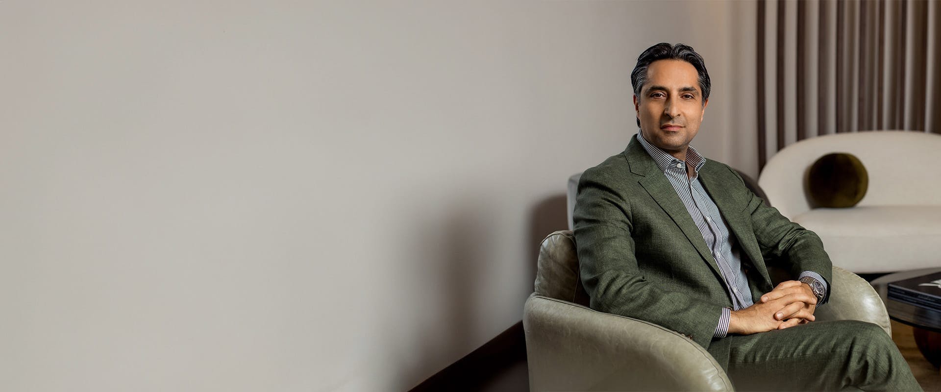 Dr. Rahban sitting on a chair