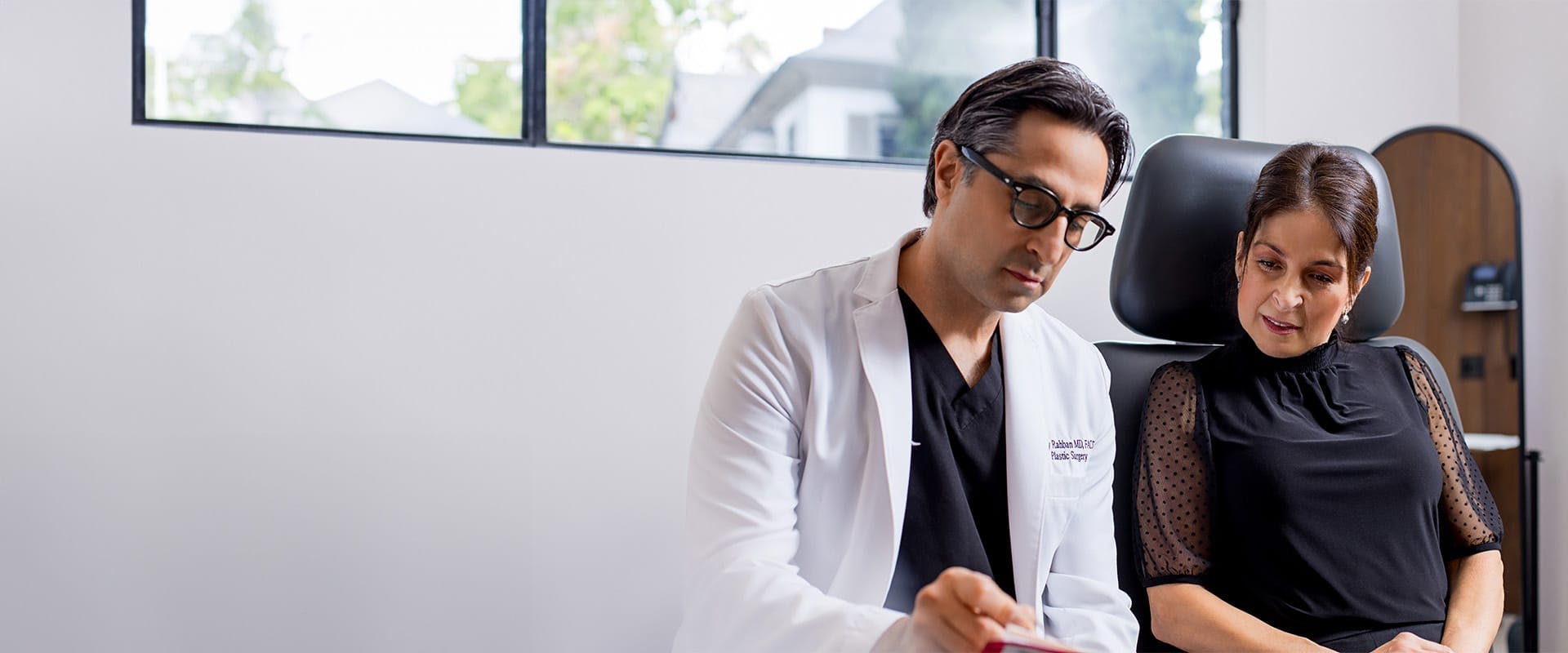 Dr. Rahban talking to a a patient