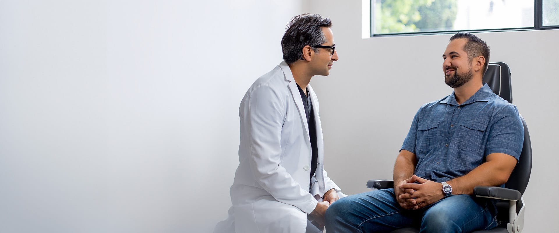 Dr. Rahban talking to a patient