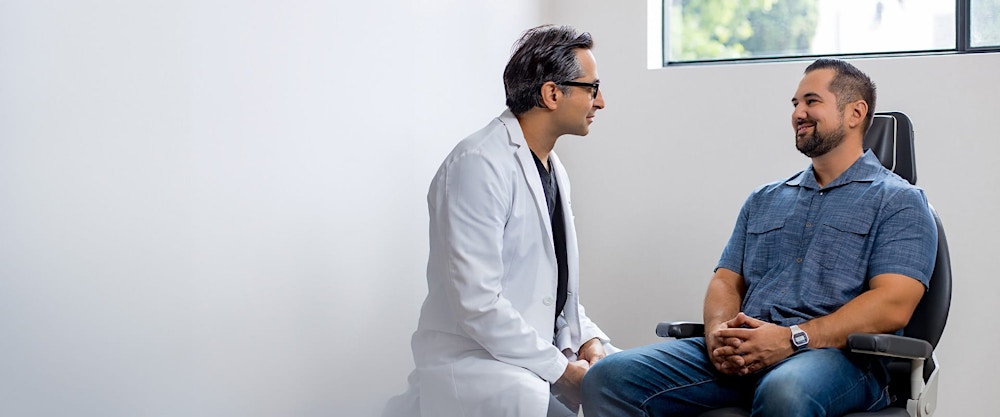 Dr. Rahban talking to a patient