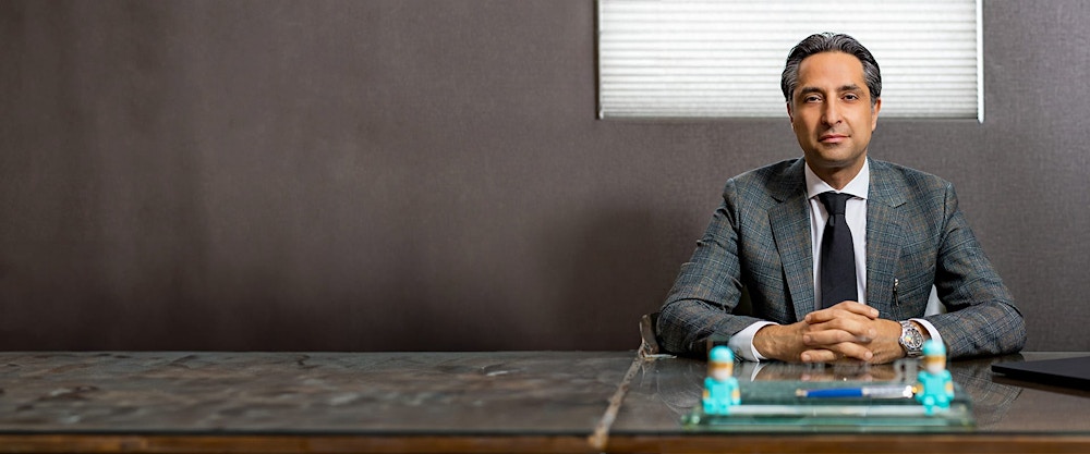 Dr. Rahban sitting at a table