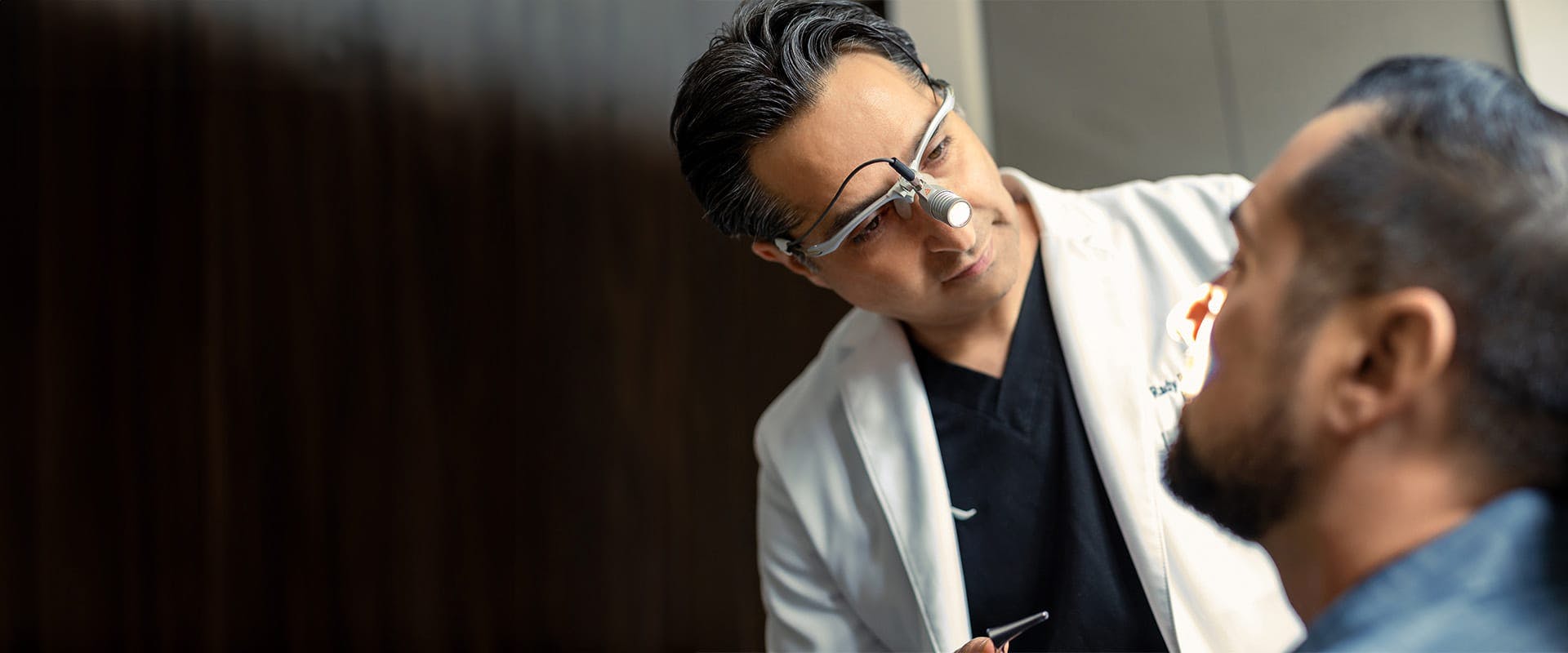 Dr. Rahban examining a patient