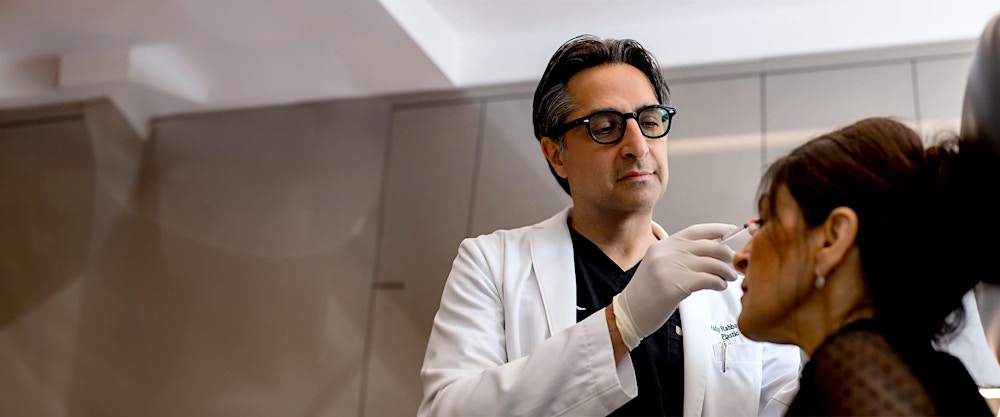 Dr. Rahban giving a patient fillers