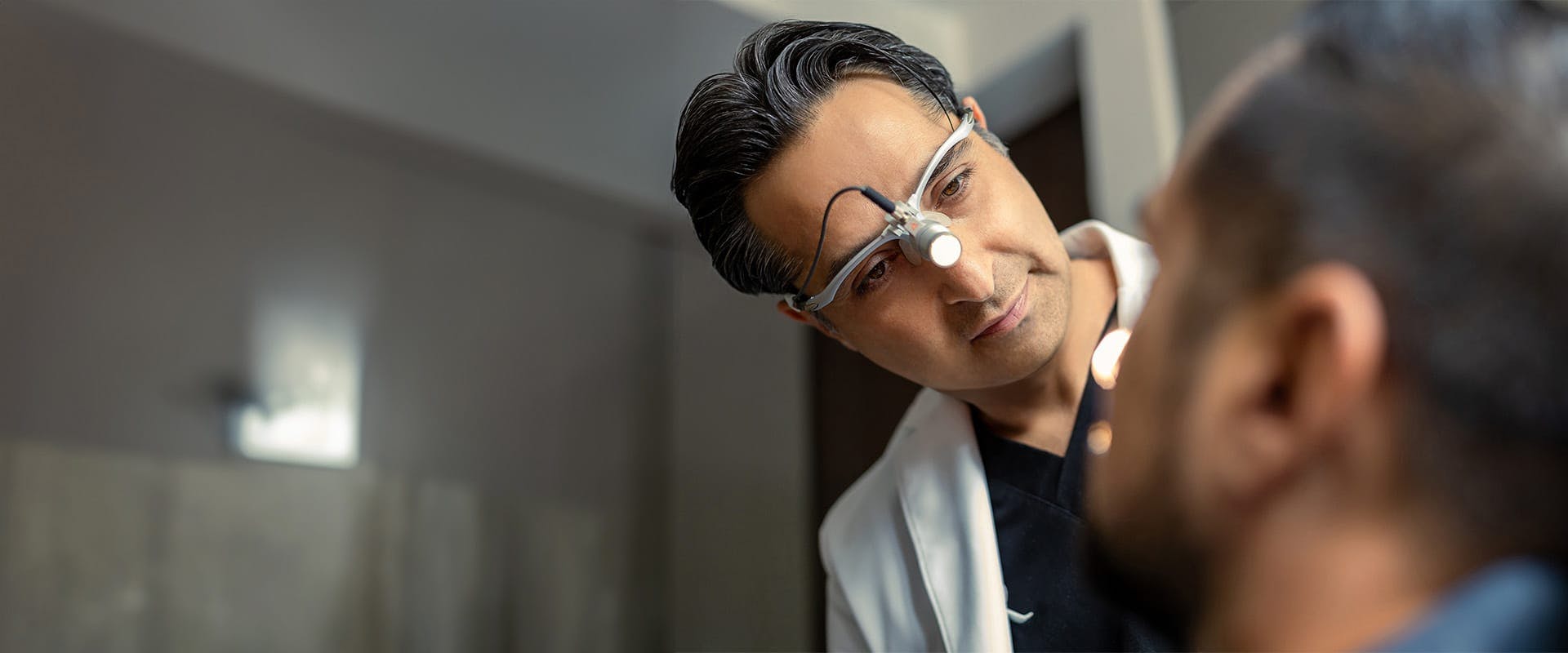 Dr. Rahban examining a patient