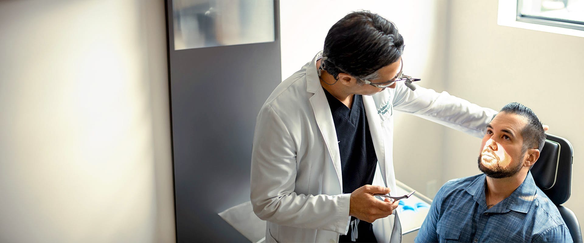 Dr. Rahban examining a patient