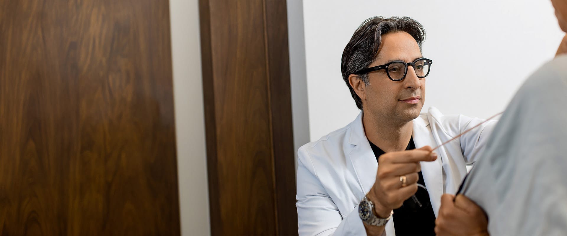 Dr. Rahban examining a patient