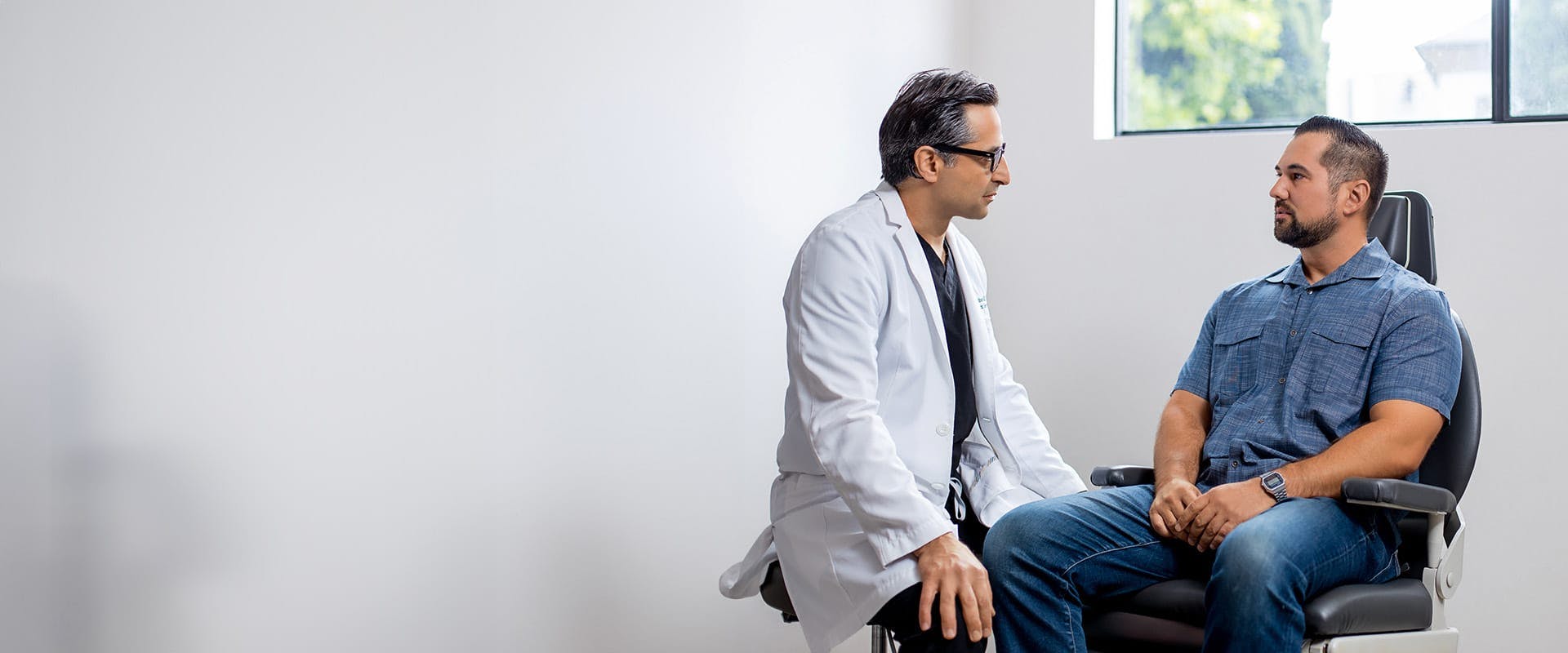 Dr. Rahban talking to a patient