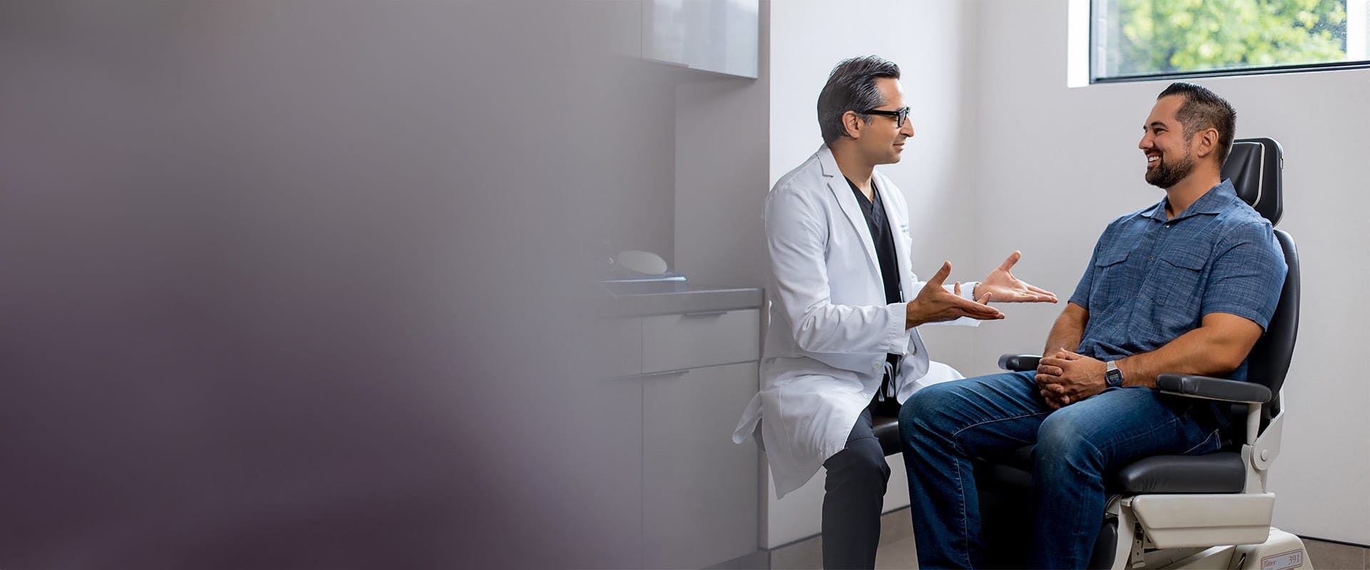 Dr. Rahban talking to a patient