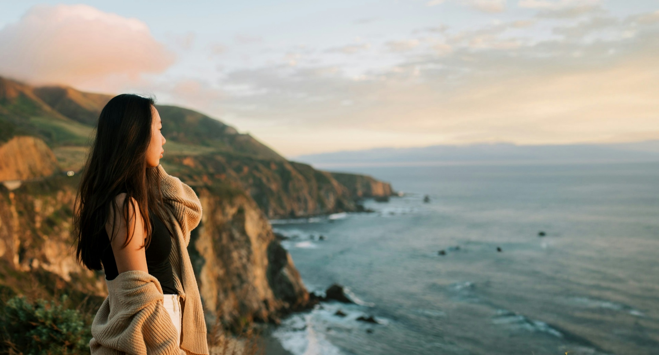 woman looking out at the beach