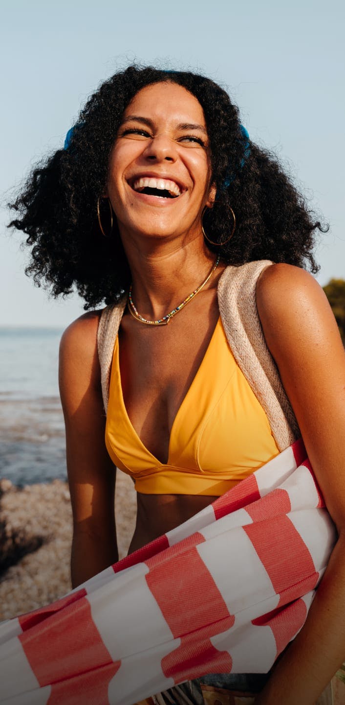 Woman smiling at the beach
