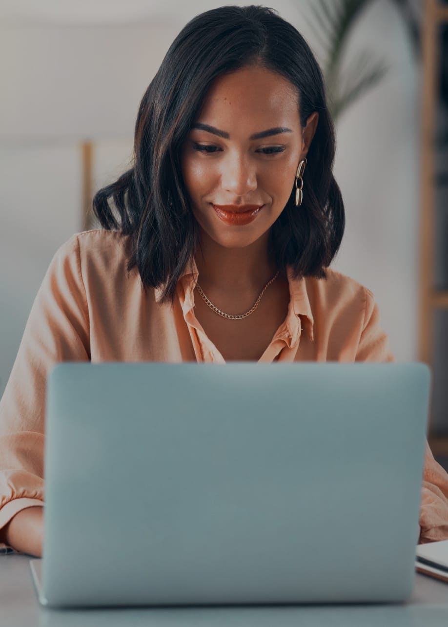 Woman with black hair on a laptop