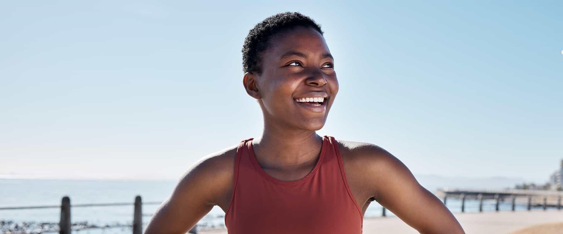 Woman on the beach smiling