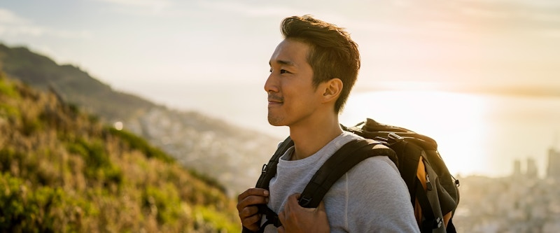 Man hiking outdoors smiling