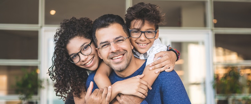 Man and kids smiling