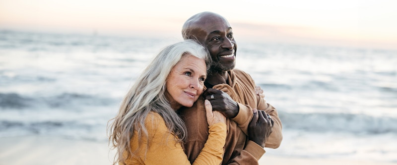 Couple on the beach smiling