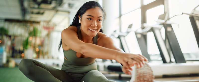 Woman stretching in the gym