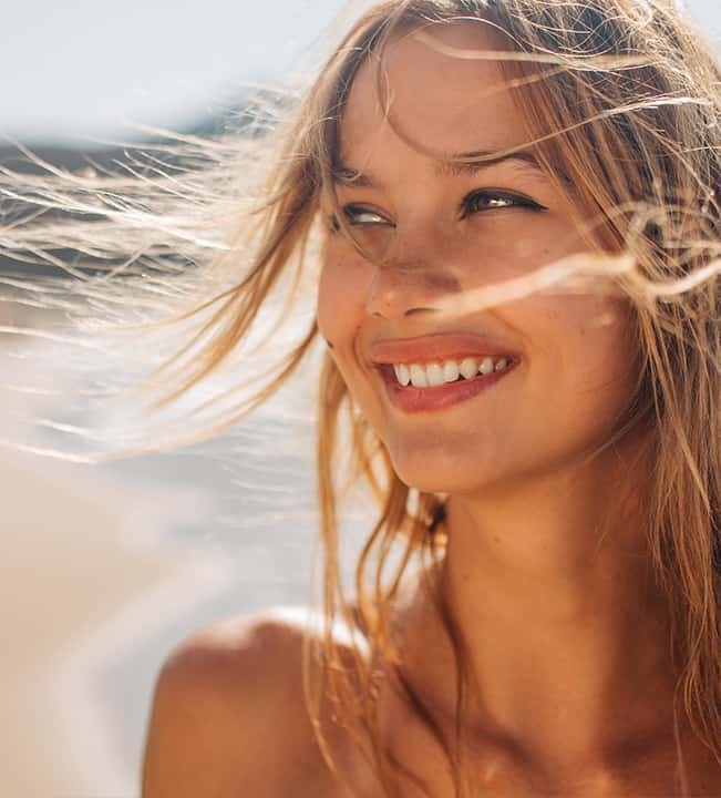 Woman smiling on the beach
