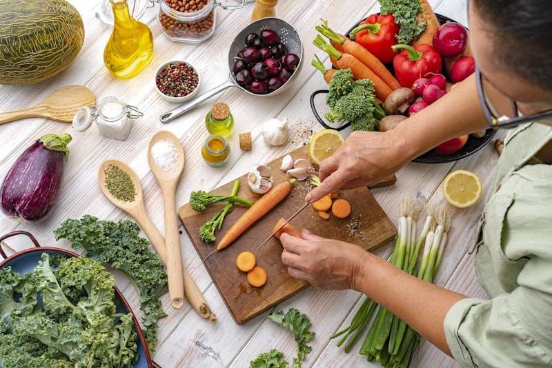 woman preparing fruits and vegetables