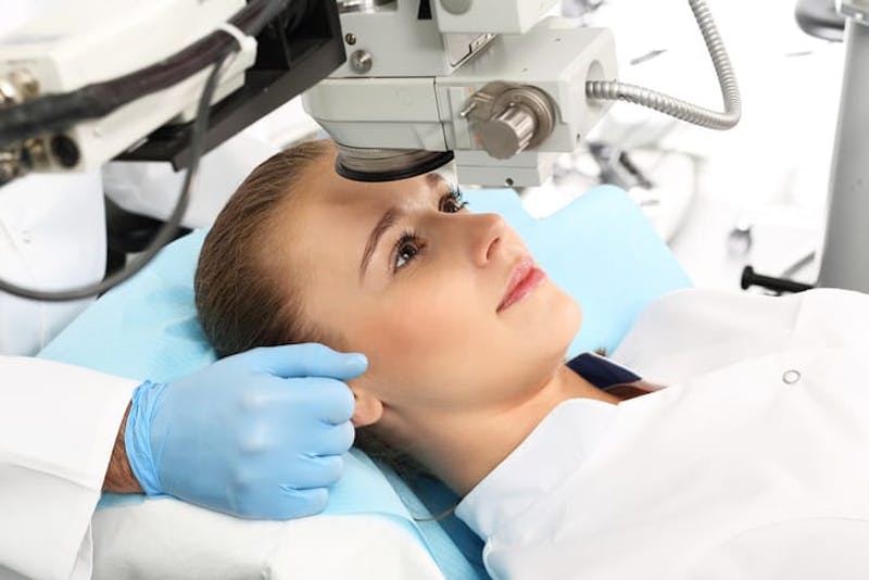 Woman receiving laser eye surgery