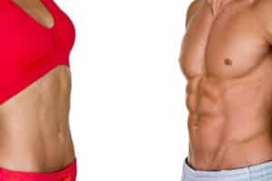 Woman and male fitness model midsections