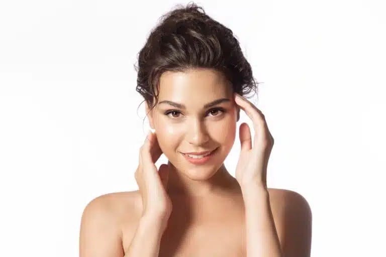 woman touching the sides of her face