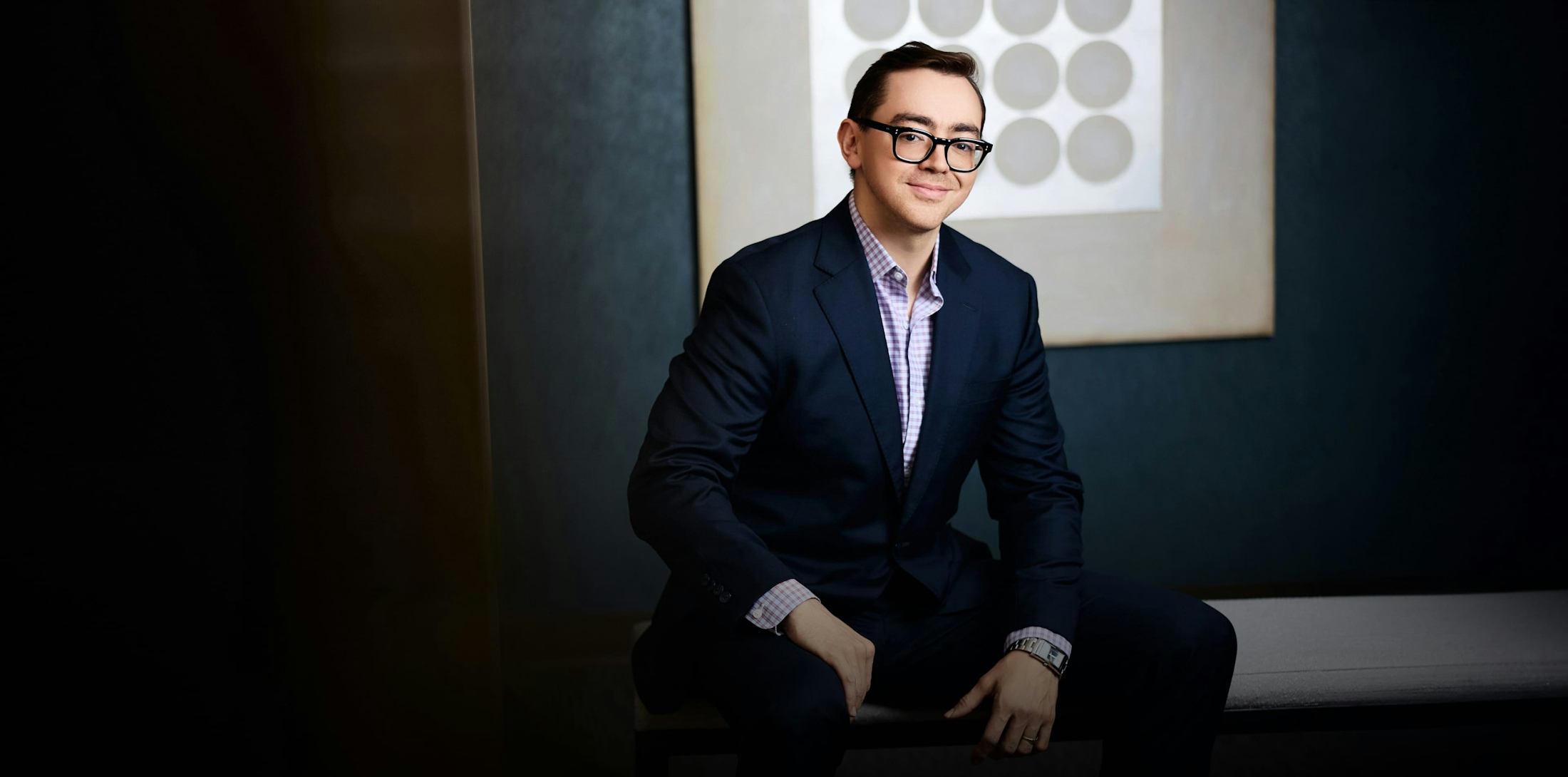 Dr. Brendan Alleyne sitting down