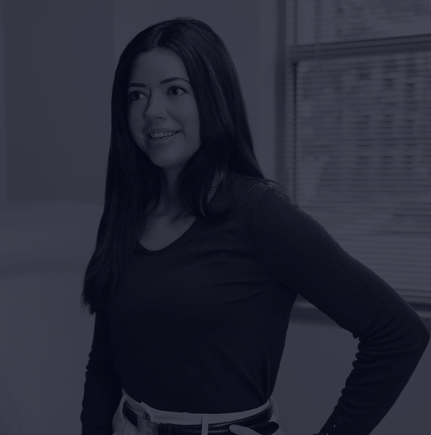 Woman standing by a window