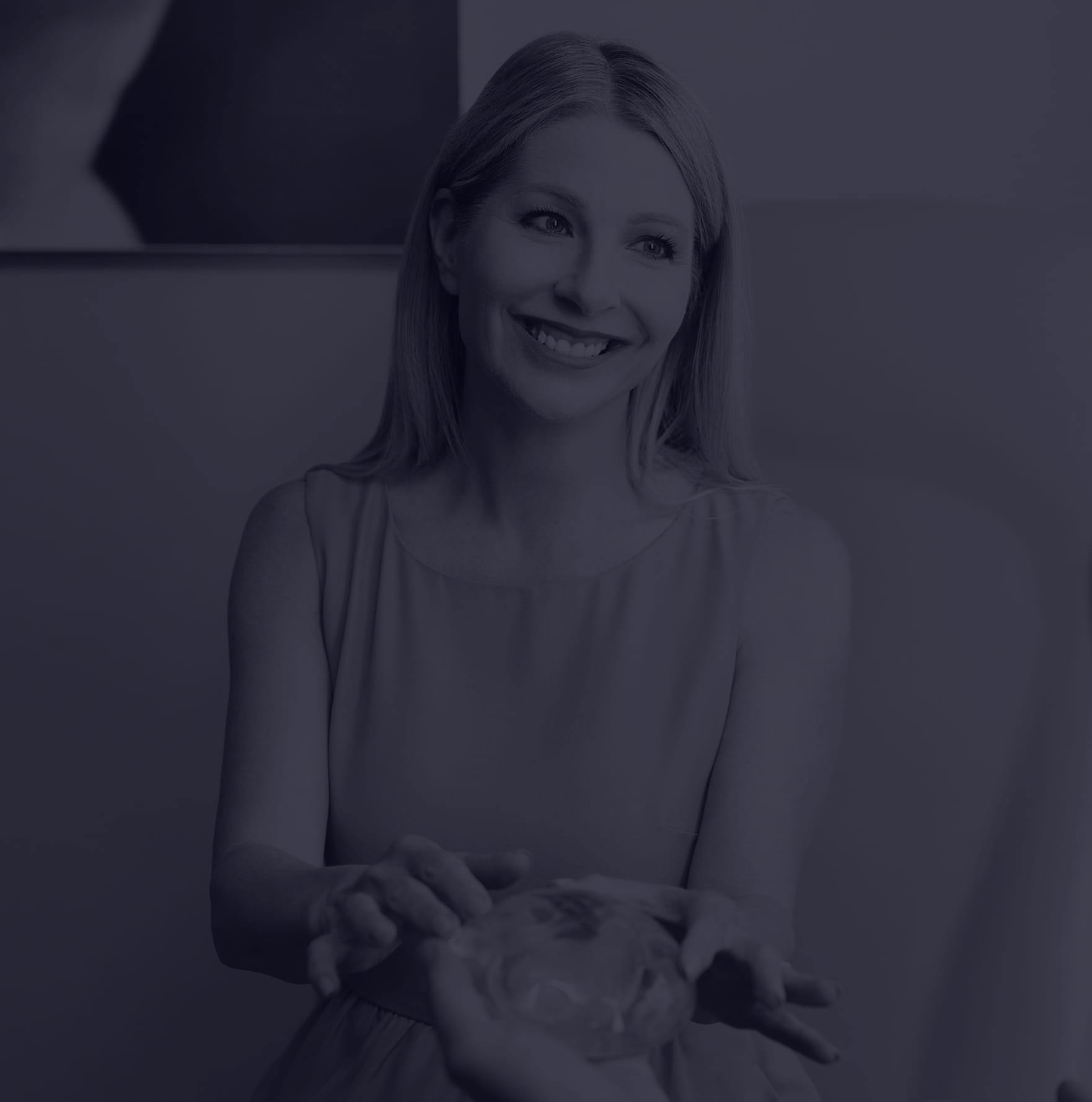 Woman holding a silicone implant