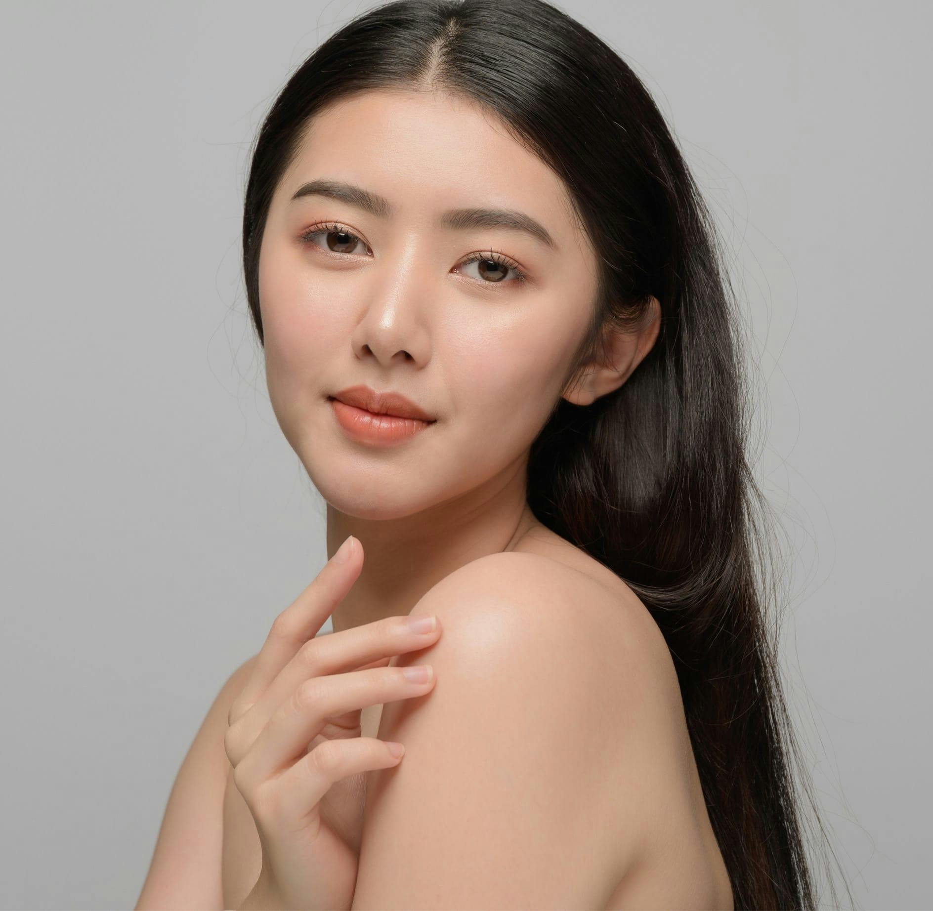 Woman smiling over shoulder