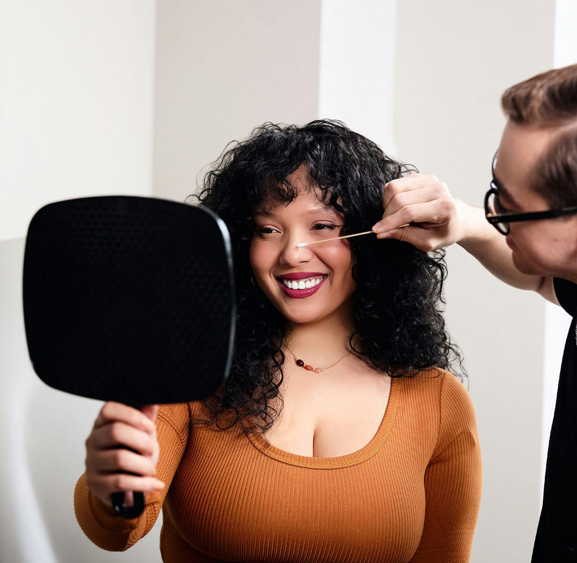 Dr. Alleyne giving facial consultation