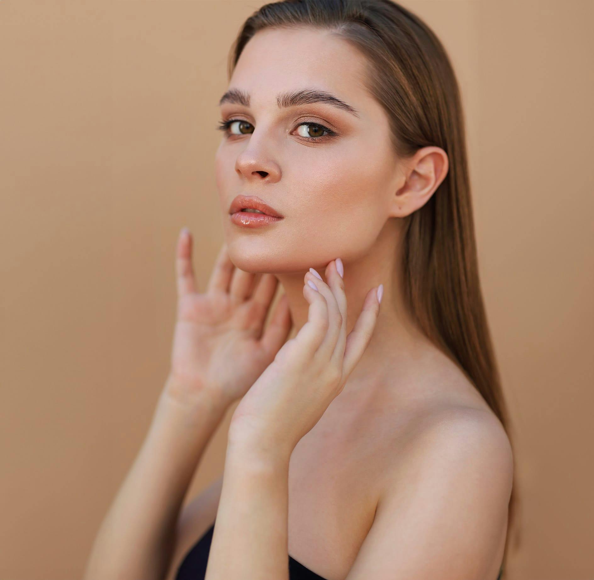 Woman running fingers over chin