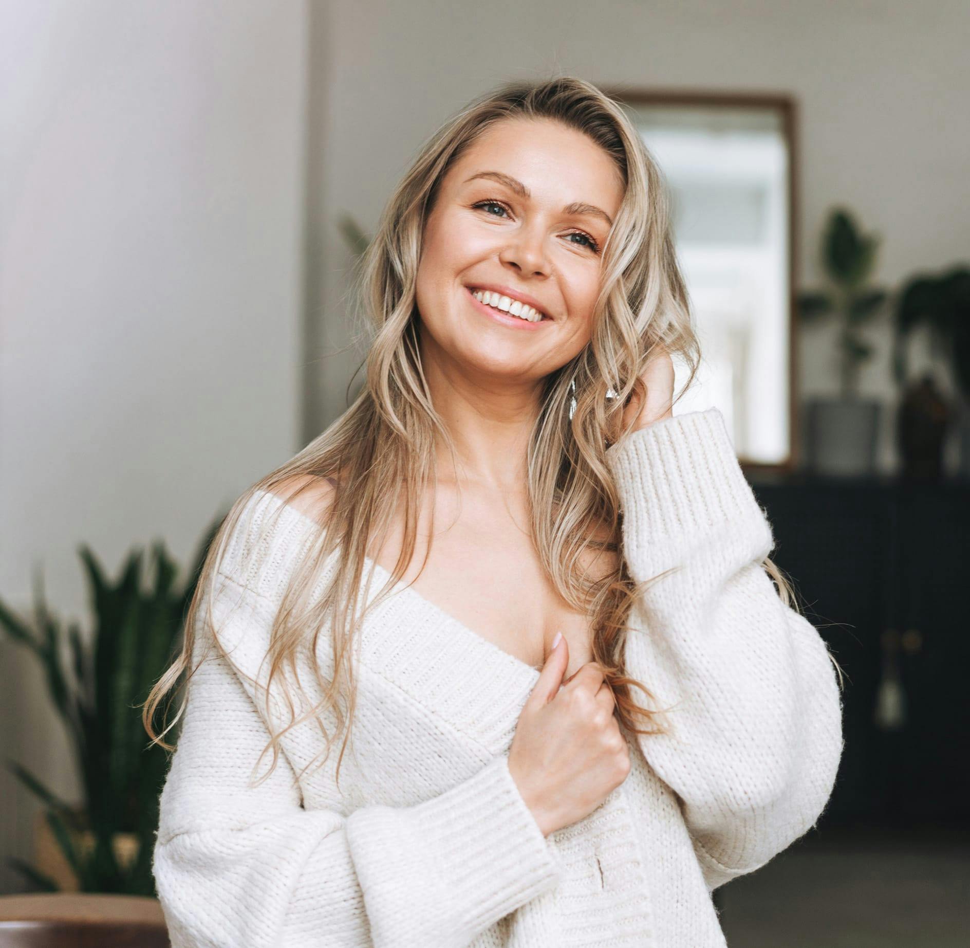 Woman in white sweater