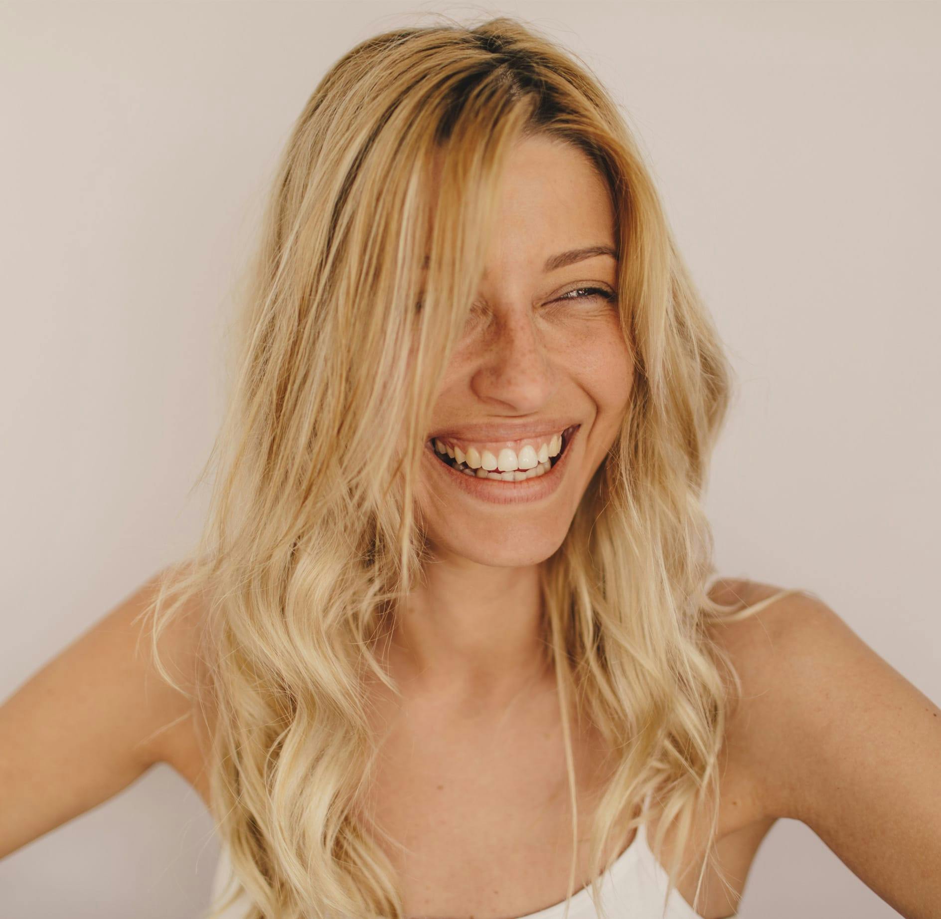 Blonde woman laughing