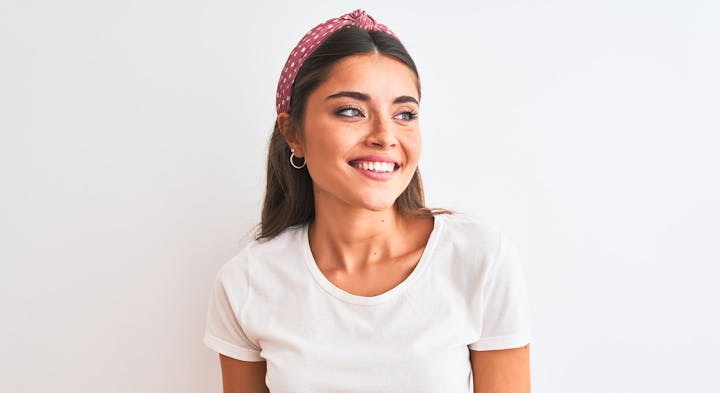 Smiling woman in white shirt