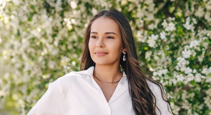 Smiling woman in white blouse