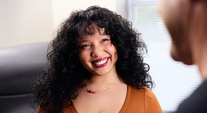 Woman smiling at doctor