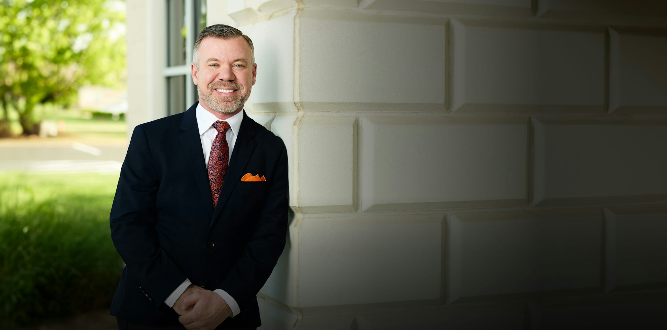 Dr. Paul Mills in a suit