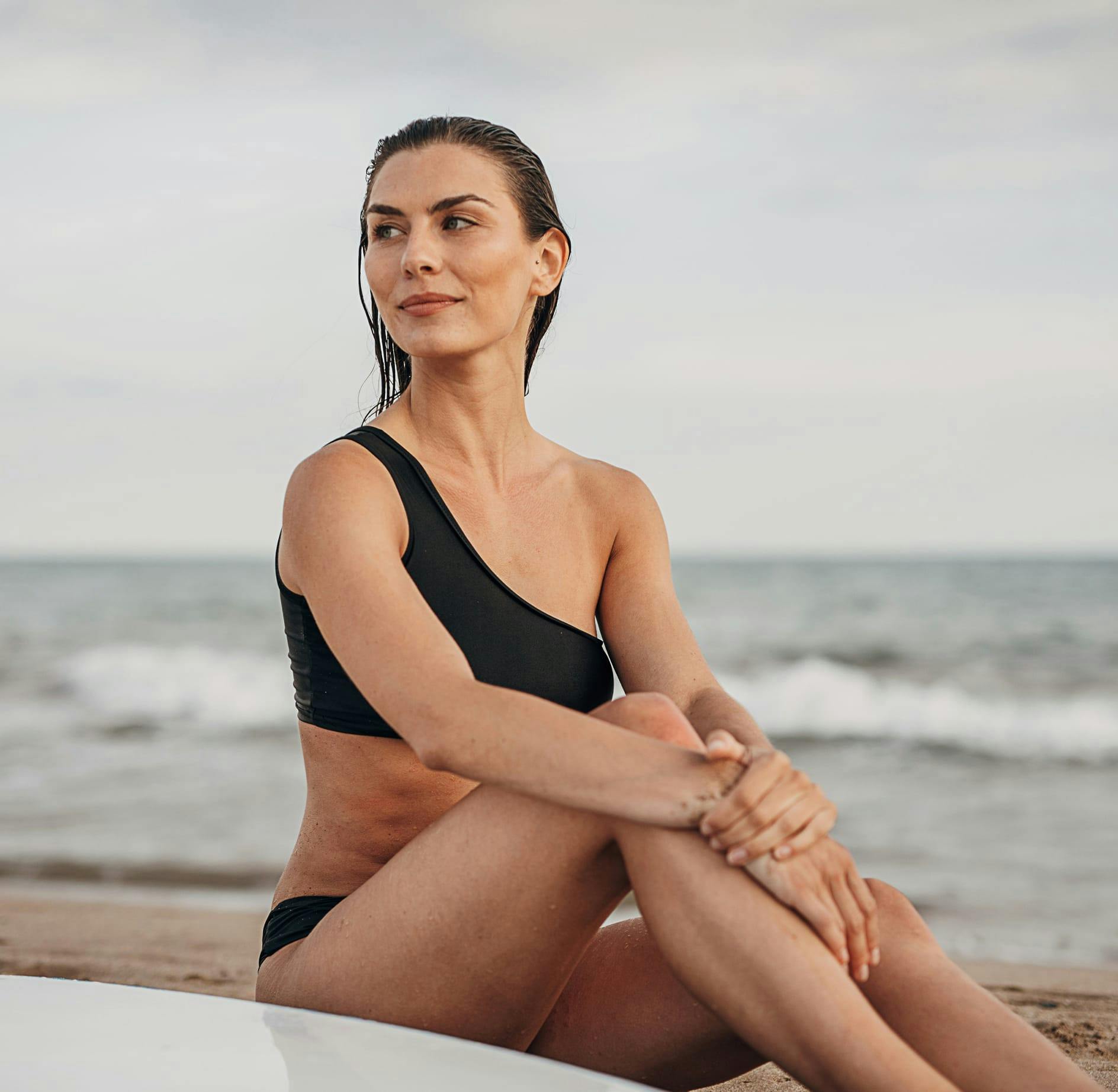 woman sitting at the beach