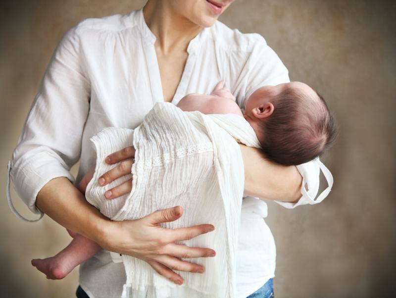 Mother holding her newborn baby