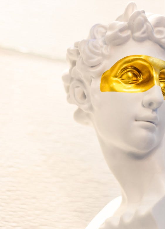 statue with a golden overlay on the eyes of it