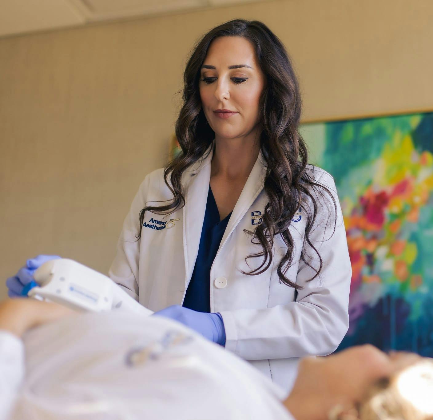 nurse looking at a coolsculpting machine
