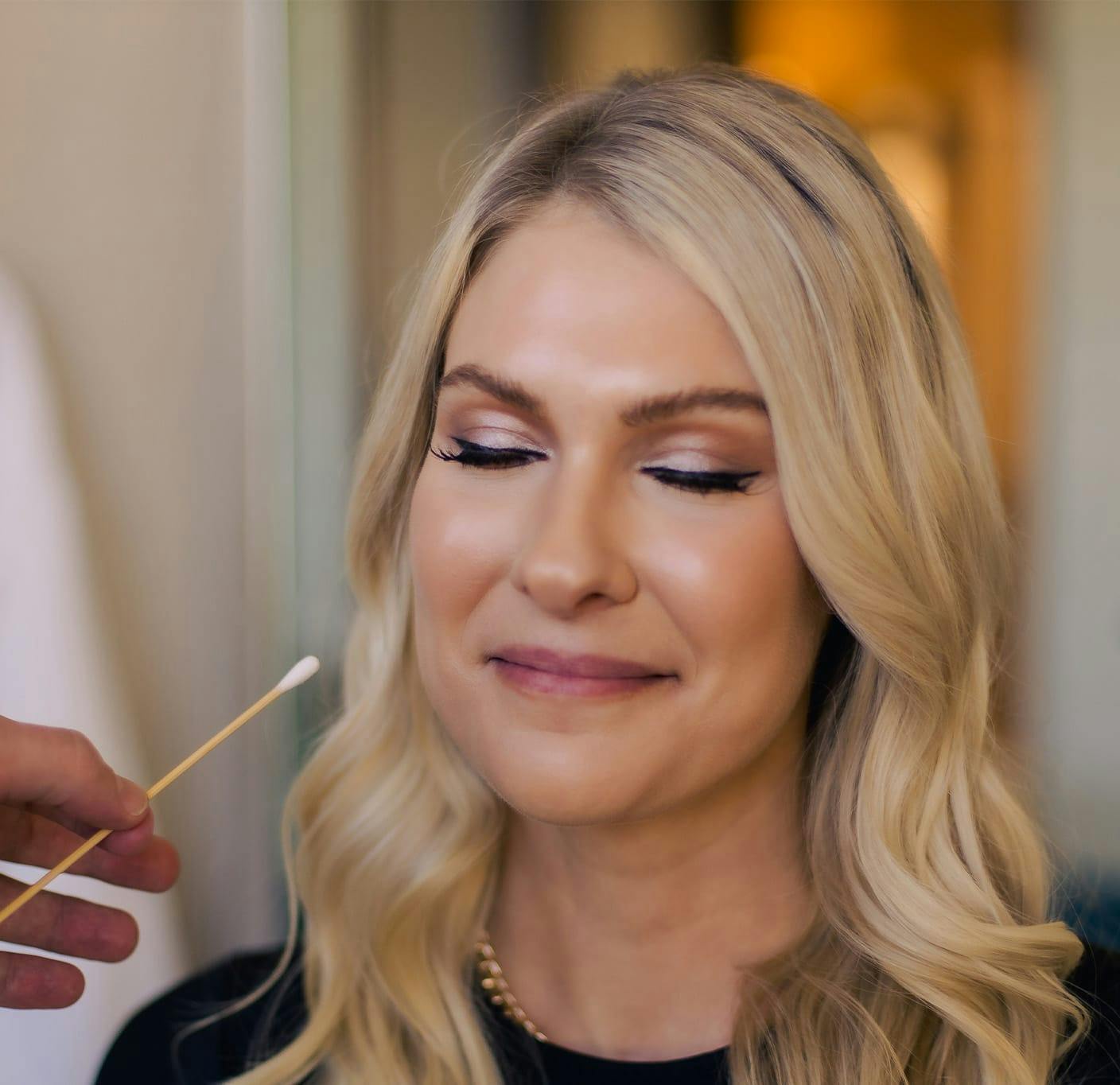Blonde woman smiling during consultation