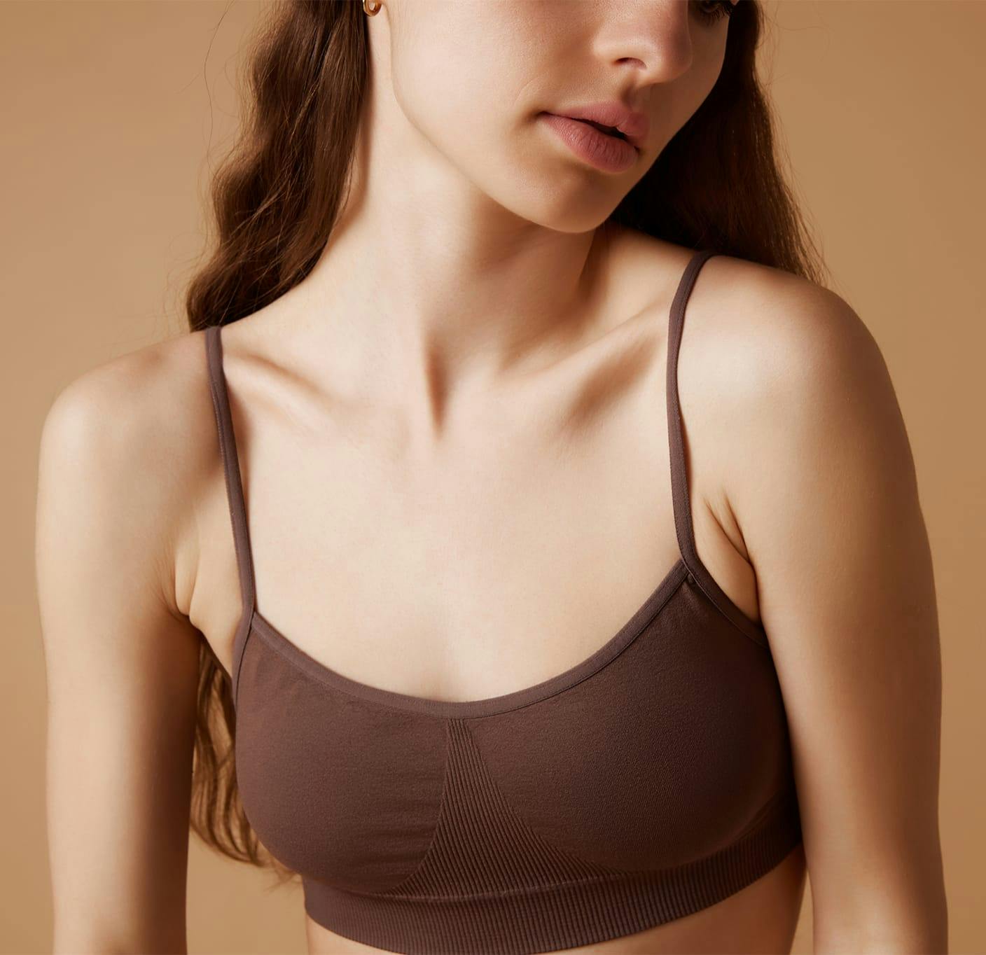 woman in brown sports bra
